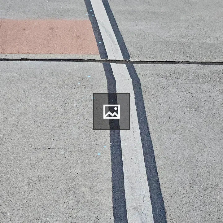 Minimal white curve on sidewalk