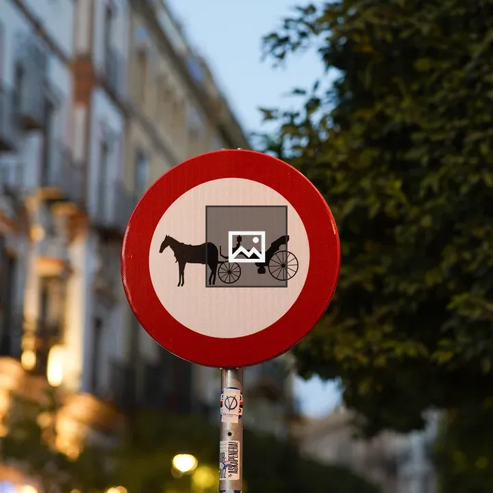 Round traffic sign with horse carriage symbol