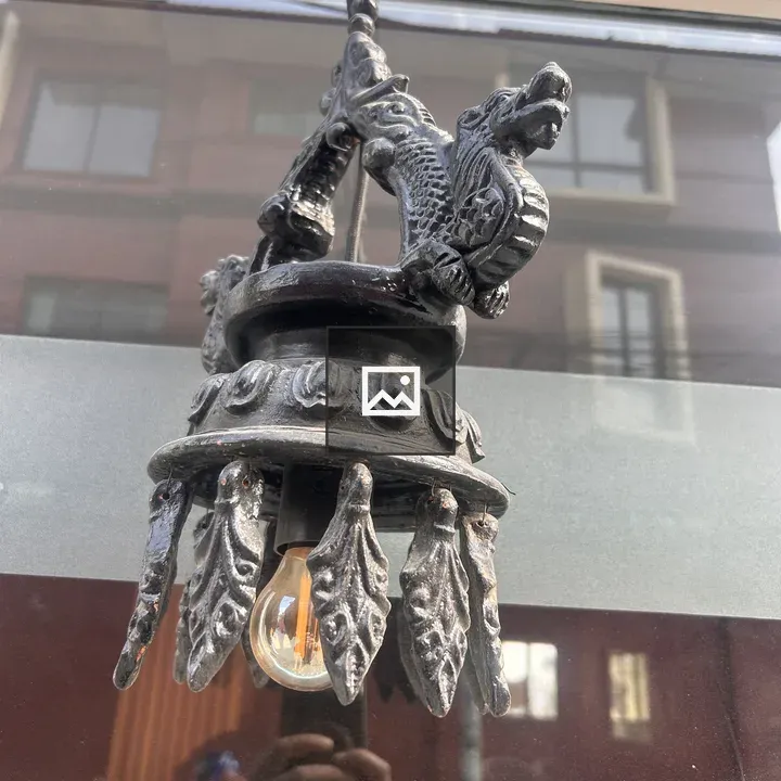 Dragon-inspired metal light fixture