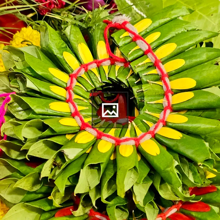 Colorful leaves and petals tied with red thread