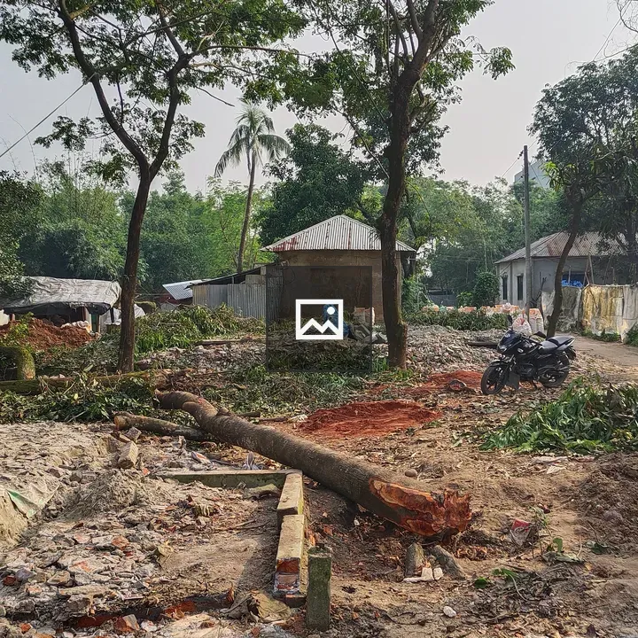 Village scene with debris and motorbike