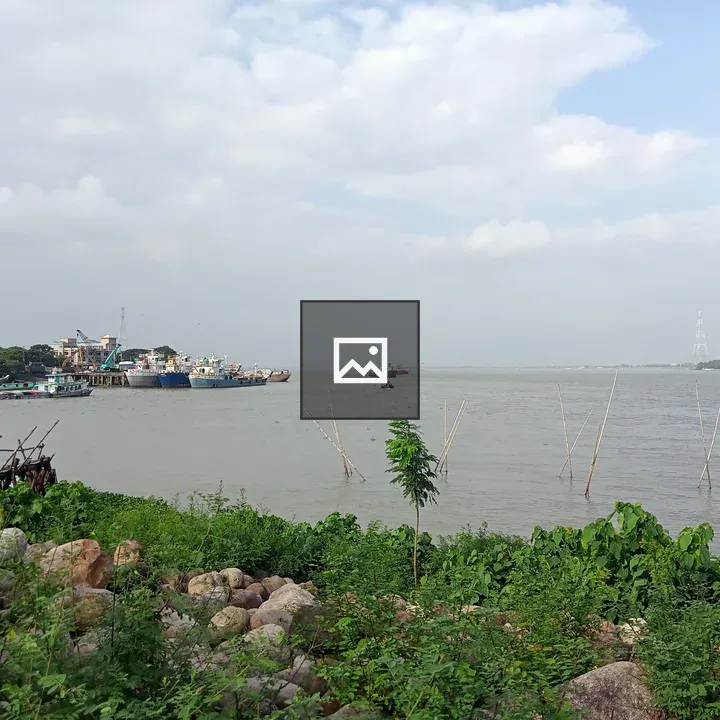 Waterfront with Boats and Rocks