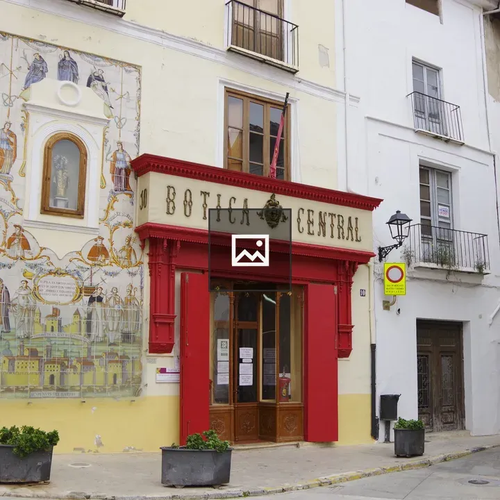Spanish mural on red wall