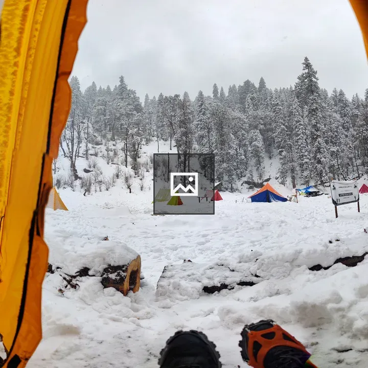 Tent opening view in snowy campsite