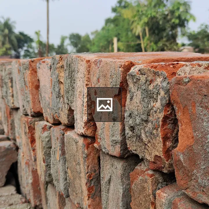 Stack of bricks on dirt road