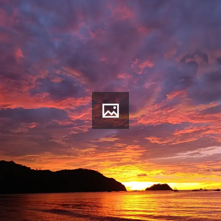 Sunset over the sea and boats