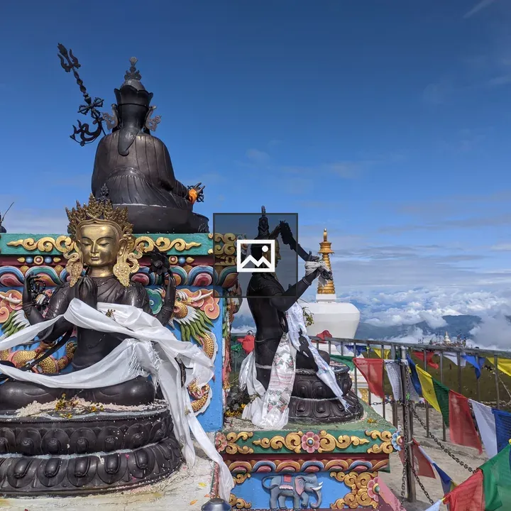 Buddhist statue on ornate pedestal