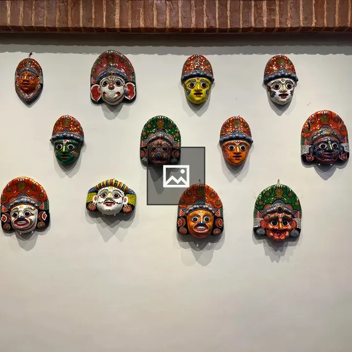 Newari masks on white wall