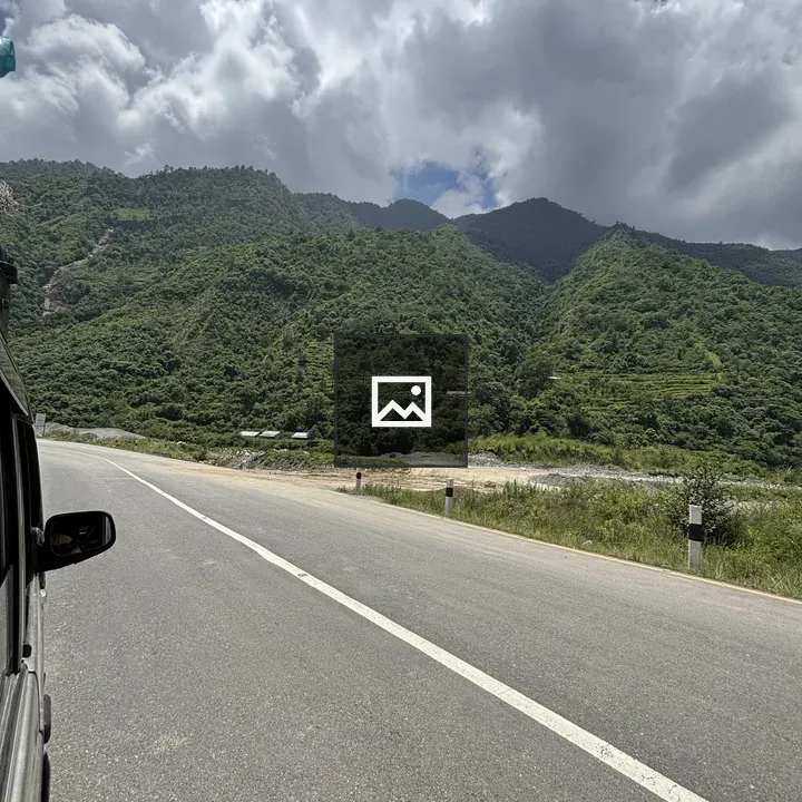 Winding road through green mountains