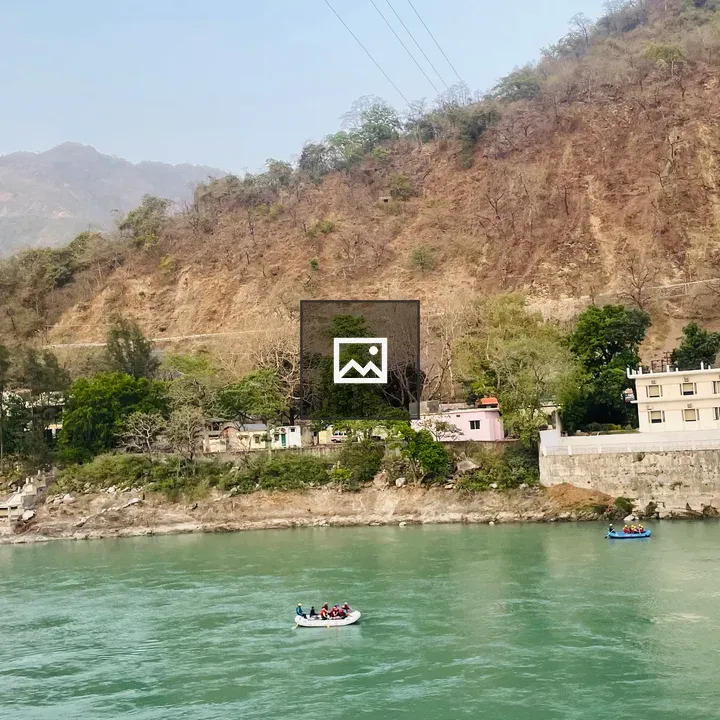 River rafting group on rocky banks