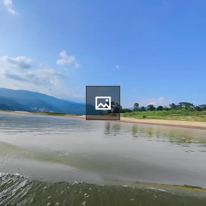 Riverside landscape with blue sky