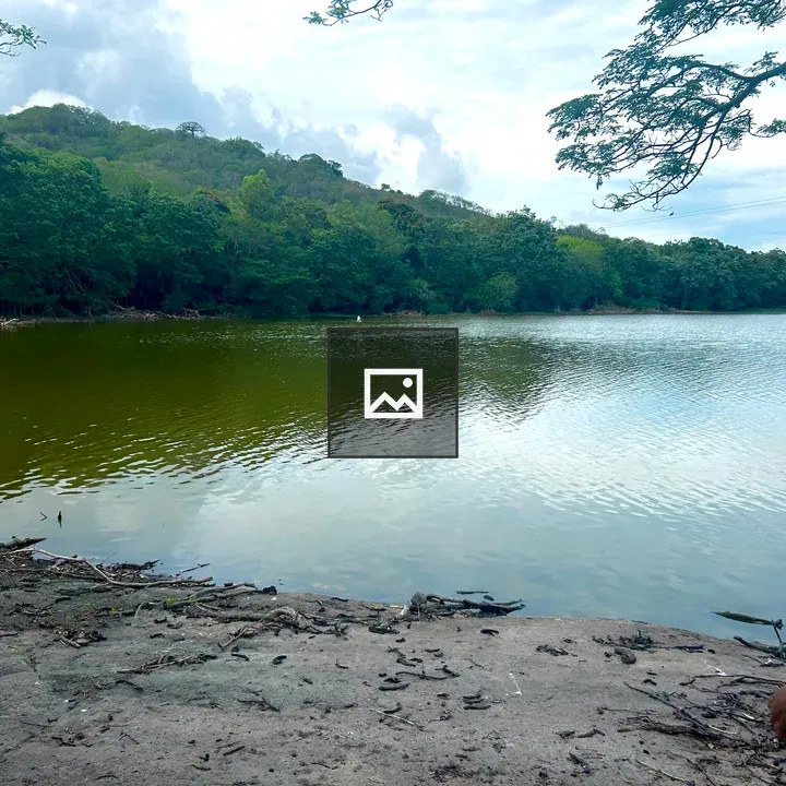 Calm lake with green hills