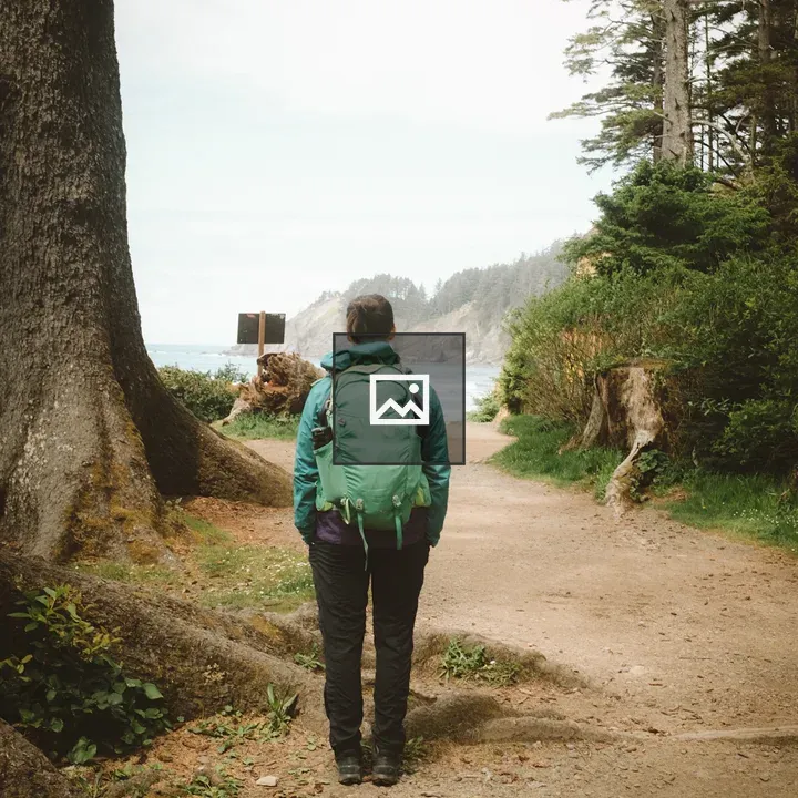 Person with hiking gear among trees