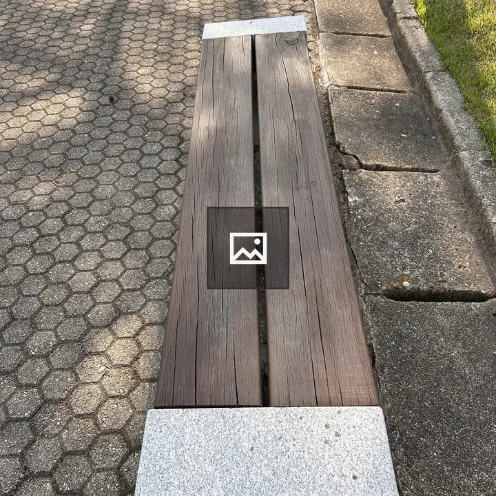 Wooden bench with stone supports