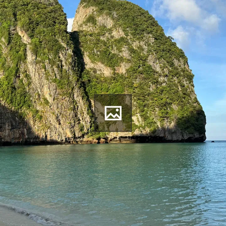 Bright tropical beach with sailboat