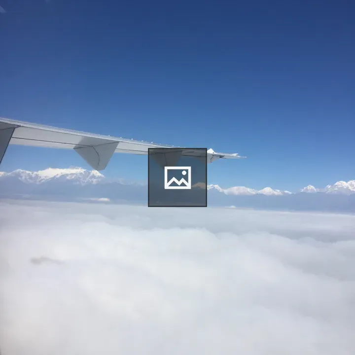 Aeroplane wing above clouds