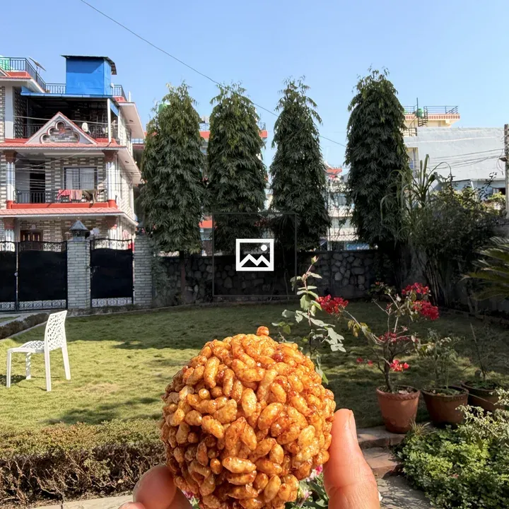 Hand Holding Puff Rice Snack