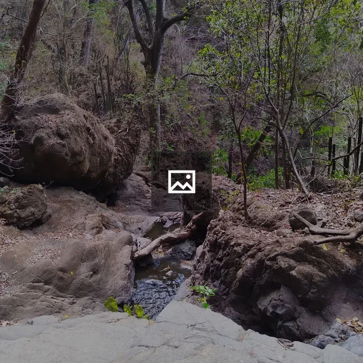 Rugged boulder landscape with stream