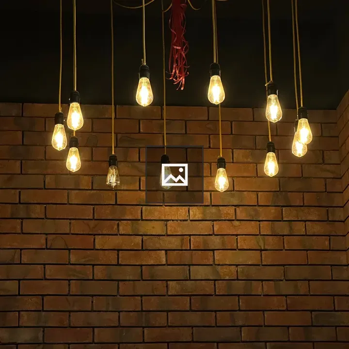 Hanging Lights by Brick Wall