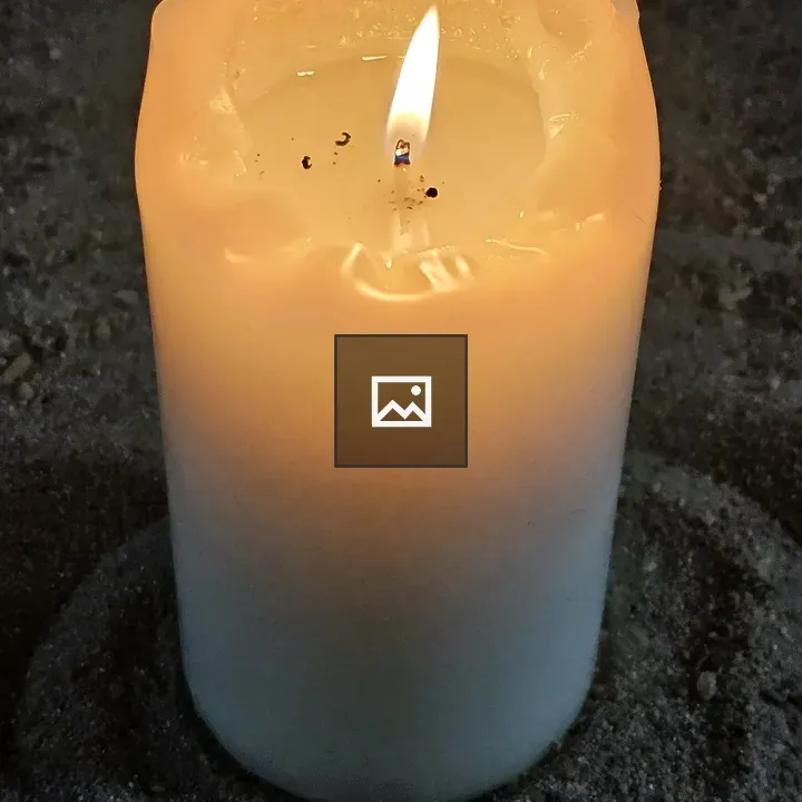 Candle Burning in Sand Bed