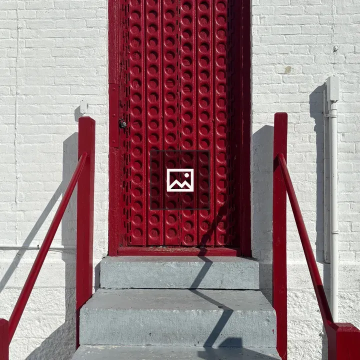 Red door on white wall