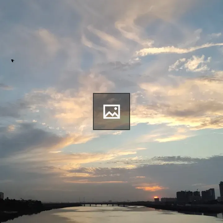 Sunset Over River and Bridge