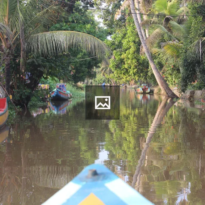 Bow View on Narrow River Boat