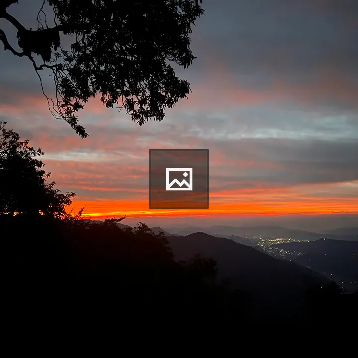 Sunset Over Valley with Lights