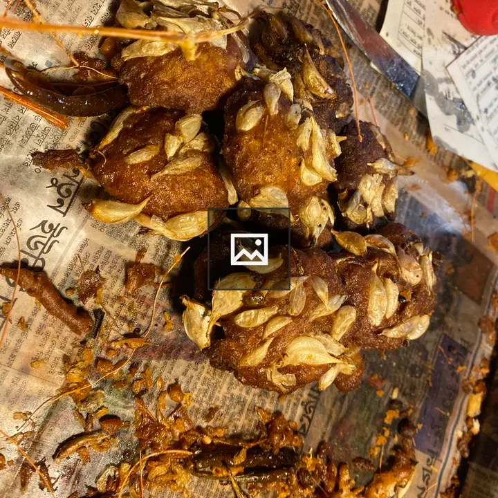 Fried Snacks on Newspaper