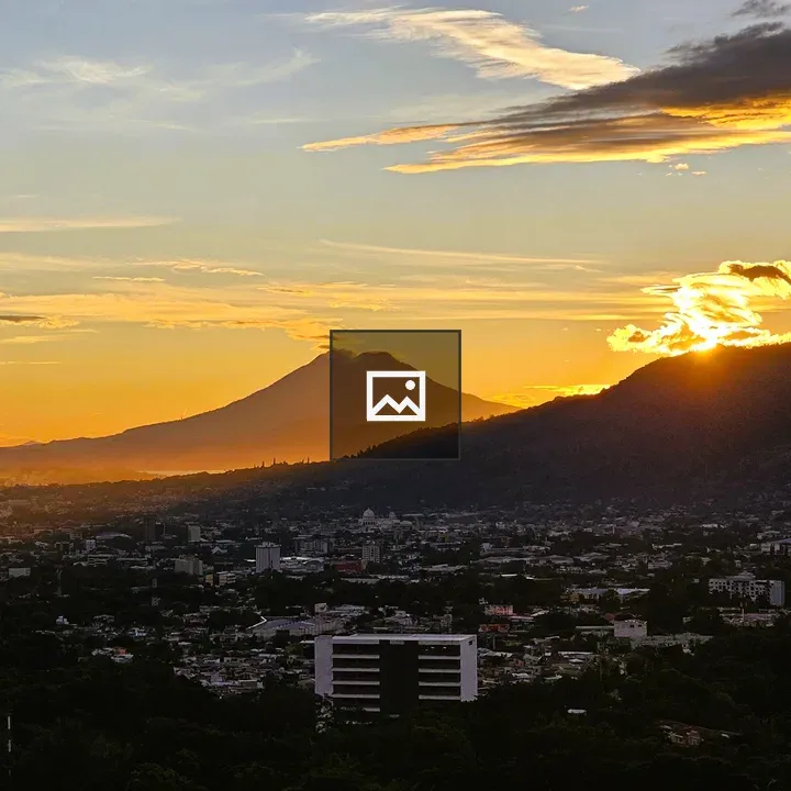 Sunset Over City and Mountains