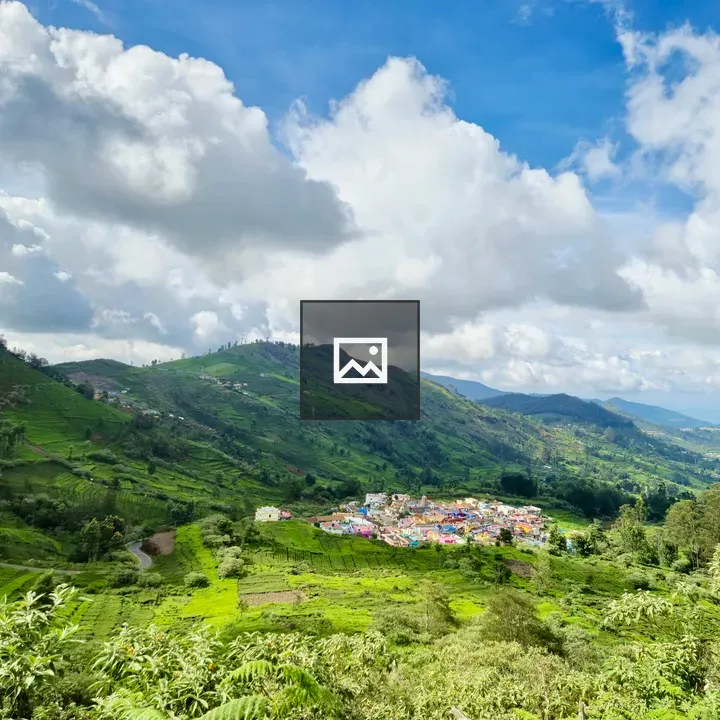 Village houses among green hills