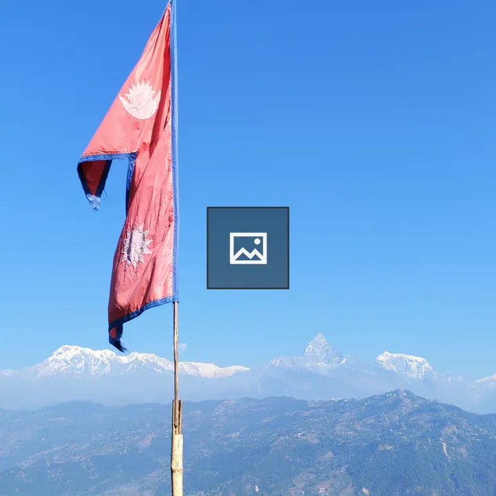 Flag of Nepal on Mountain Ridge