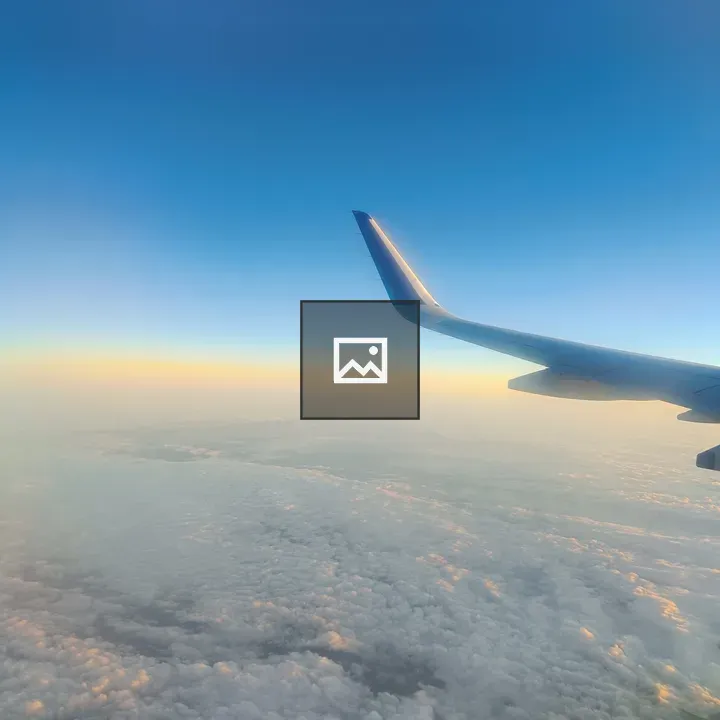 Airplane Above Clouds