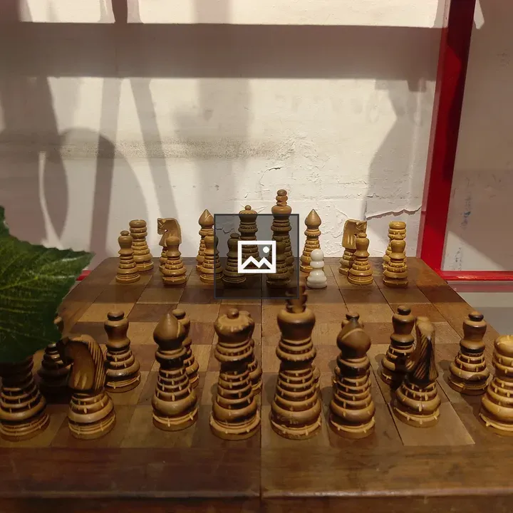 Wooden Chessboard with Carved Pieces