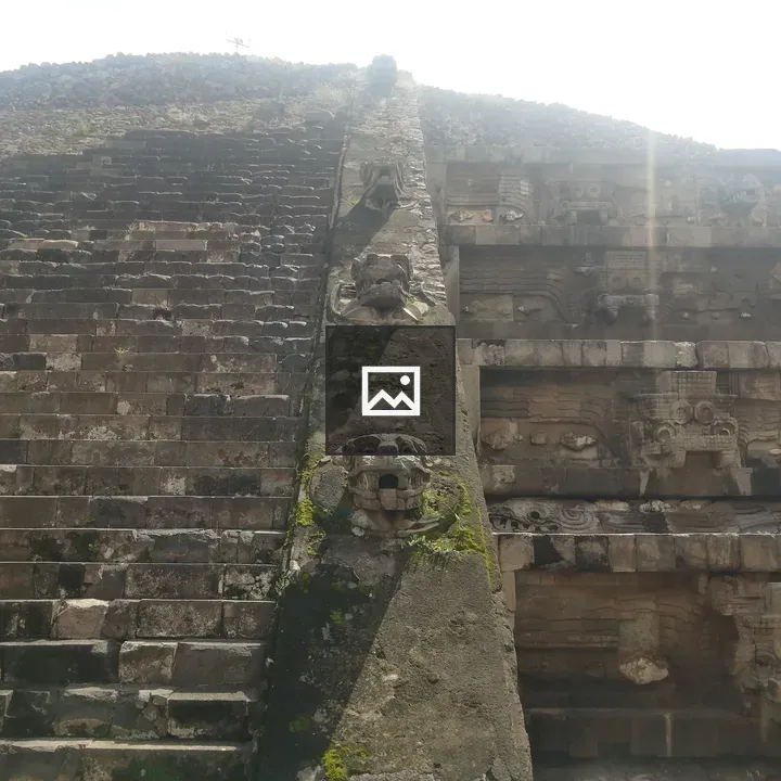 Stone pyramid with carved reliefs