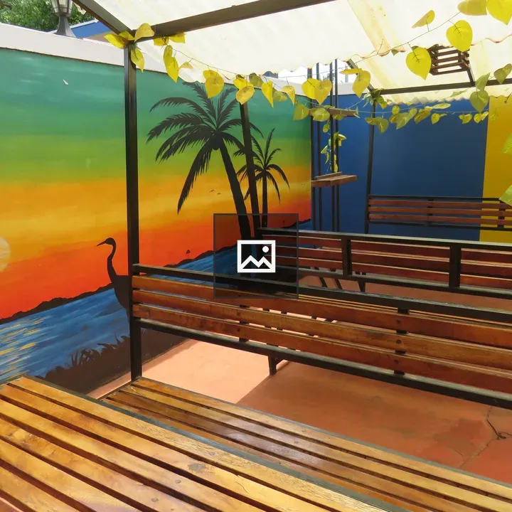 Outdoor seating area with mural