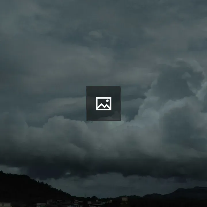 Cloudy Sky at Distant Peaks