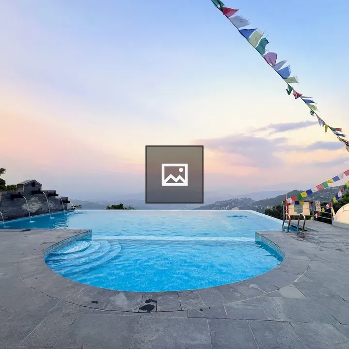 Outdoor infinity pool with prayer flags