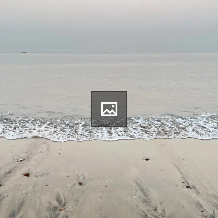 A Sandy Beach with Incoming Wave