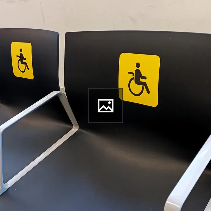 Airport seating with yellow reserved stickers