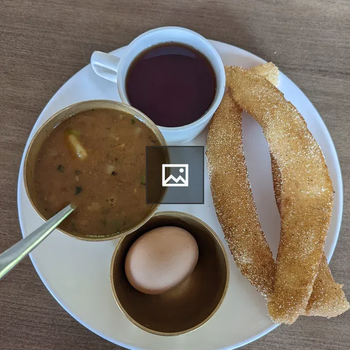 Round white plate with fried snacks