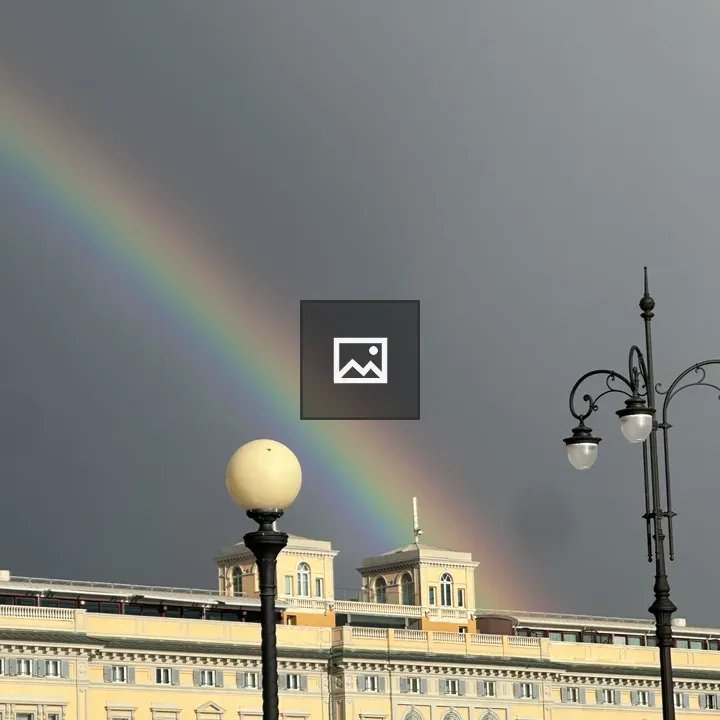 Rainbow over yellow building