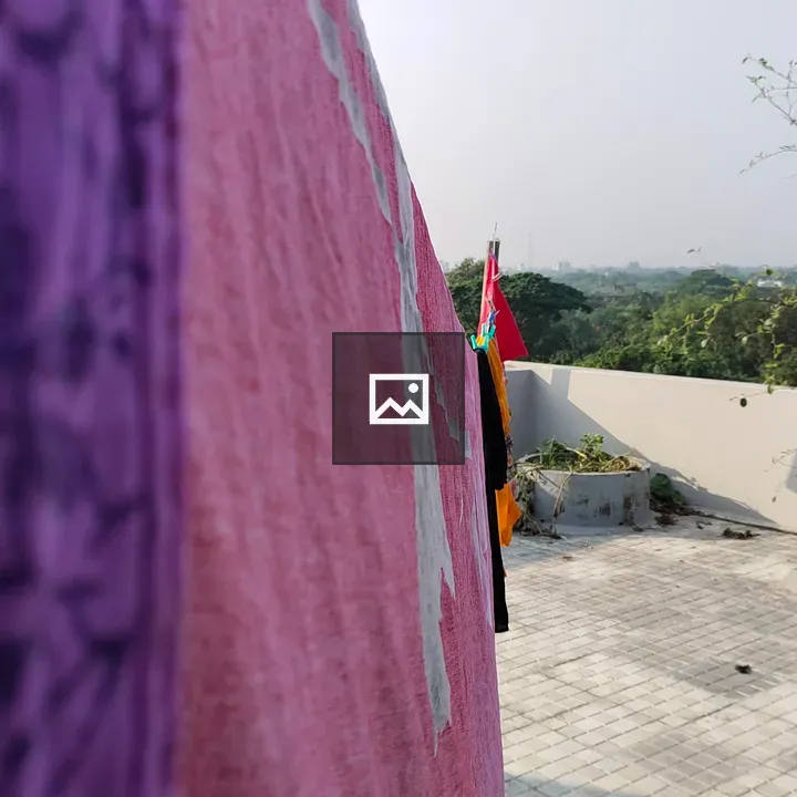 Serene balcony with tree and towel