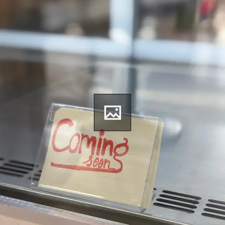 Coming soon sign on paper
