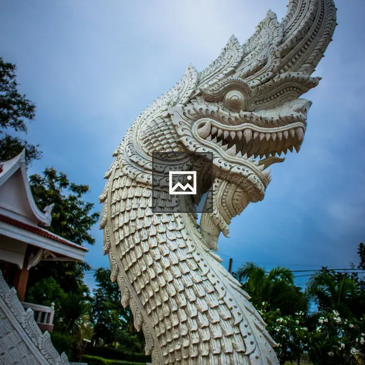 Statue of dragon with blue sky