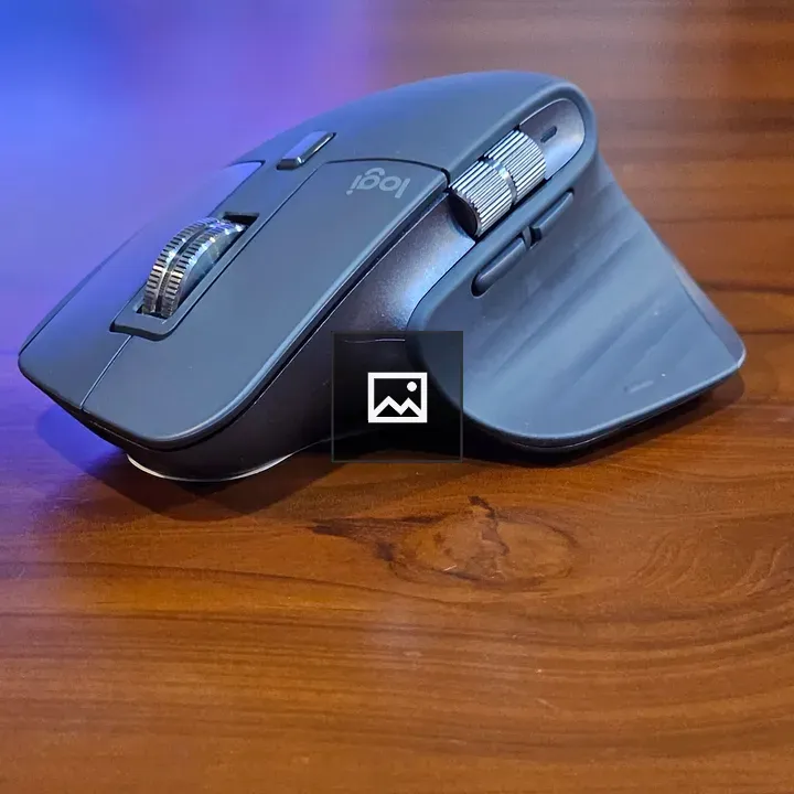 Computer mouse on wooden table