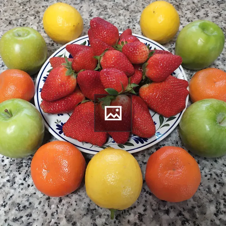 Assorted Citrus and Berries on Table