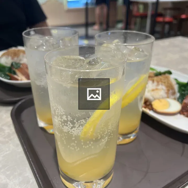 Three glasses of lemonade on tray