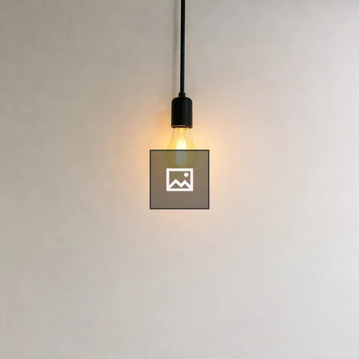 Edison-style bulb on white wall