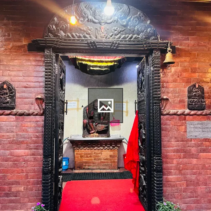 Hindu temple doorway with Shani Dev statue